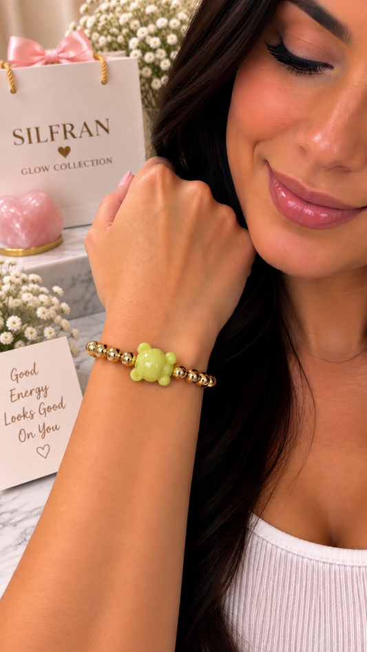 Add a playful touch to your jewelry collection with this 14K Gold-Plated Round Hematite Beaded Bracelet, featuring a small bear charm as the centerpiece. The polished gold-tone hematite beads create an elegant, versatile look, while the petite bear adds a fun and charming detail